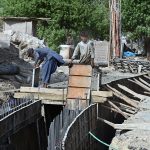 Labourers are busy in constructing work of sewerage Nala as part of development work on Autobahn Road