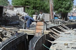 Labourers are busy in constructing work of sewerage Nala as part of development work on Autobahn Road