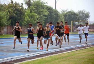 Female athletes are throwing the shot put during various sports competitions at the Firdous Track on Jhang Road.