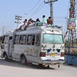 A large number of passengers travel on the rooftop of a coach at Fateh Chowk, highlighting a serious safety concern that requires the attention of the concerned authorities