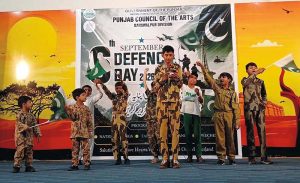 - School students perform in tableau during the Pakistan Defense Day event organized by the Punjab Council of the Arts.