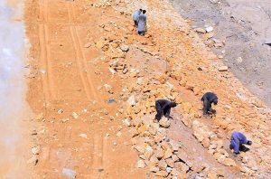 Labourers busy with construction work on Wadhu Wah Road as development work continues in the city.