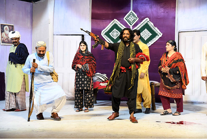 Artists performing in a drama “ Mitti ” presented jointly by the Arts Council of Pakistan Karachi and Larkana during the Sindh Drama Festival 2026 at Z.A. Bhutto Open-Air Theatre Arts Council