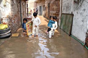 Canal water floods a road in Jinnah Colony following an overflow, disrupting traffic and commuters.