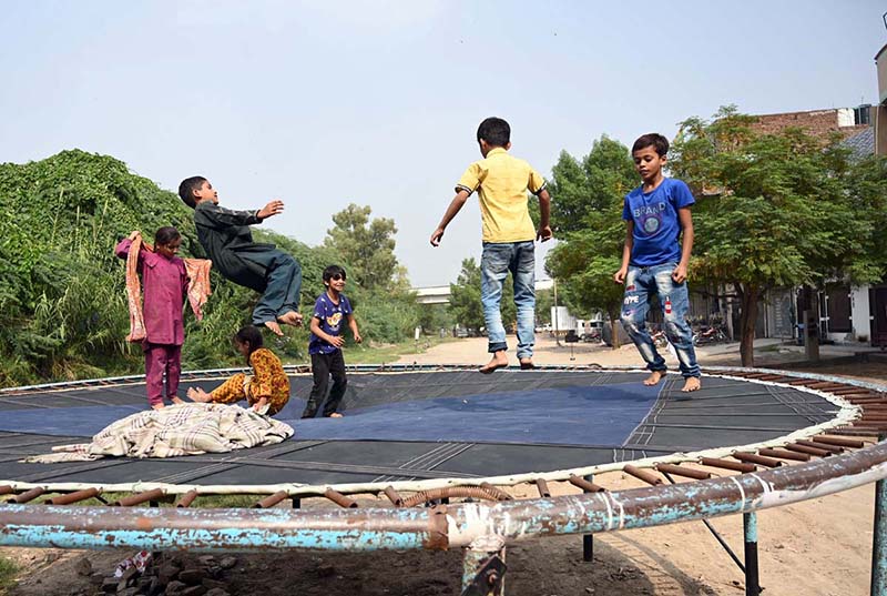 Children enjoy jumping on a trampoline at Tewana Park