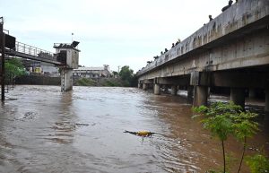 A view of Nullah Leh flowing at a dangerously high level following heavy monsoon rains, as the swollen waterway poses a serious threat to residential areas and settlements built along its banks in the Federal capital.