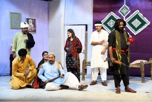 Artists performing in a drama “ Mitti ” presented jointly by the Arts Council of Pakistan Karachi and Larkana during the Sindh Drama Festival 2026 at Z.A. Bhutto Open-Air Theatre Arts Council