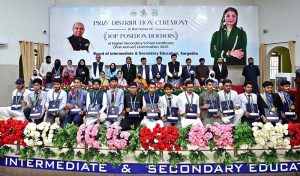 Chairman Education Board Abbash Ahmad Gondal and Vice Chancellor University of Sargodha Prof. Dr. Tasawar Hayyat awarding a gold medal and certificate to a position holder student during prize distribution ceremony of Higher Secondary School Certificate (HSSC) Annual Examination-2026 at Education Board Multipurpose Hall.