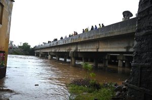 A view of Nullah Leh flowing at a dangerously high level following heavy monsoon rains, as the swollen waterway poses a serious threat to residential areas and settlements built along its banks in the Federal capital.