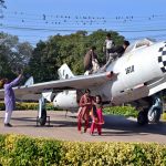 Children enjoying weekend by visiting a model plane installed by Pakistan Air Force at China Chowk
