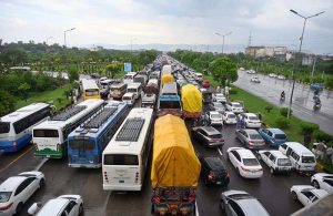 A view of a massive traffic jam on the main Expressway as vehicles move through floodwater following heavy monsoon rainfall in the Federal capital.