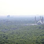 A panoramic aerial view of showing the iconic Faisal Masjid amid a hazy atmosphere begin to descend over the federal capital with the change of season