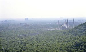 A panoramic aerial view of showing the iconic Faisal Masjid amid a hazy atmosphere begin to descend over the federal capital with the change of season
