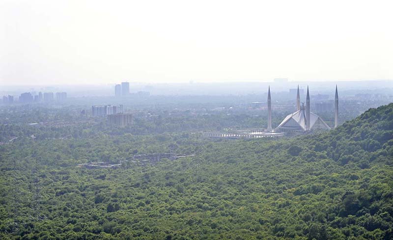 A panoramic aerial view of showing the iconic Faisal Masjid amid a hazy atmosphere begin to descend over the federal capital with the change of season