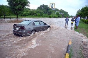 A view of vehicles moving through floodwater on the main Expressway following heavy monsoon rainfall in the Federal Capital.