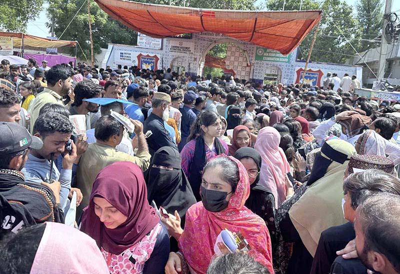 A large number of family members of the students are waiting outside the MDCAT 2026 test center as students are coming out after the test