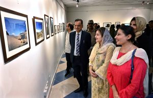 Parliamentary Secretary for Federal Education and Professional Training Ms. Farah Naz Akbar views photographs on display at the “Frames of Freedom” exhibition, celebrating Pakistan’s beauty, heritage, cultural diversity and national spirit, following its inauguration at the COMSATS Art Gallery.