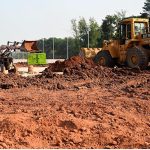 Heavy machinery work alongside labourers at the Park Road Underpass project site, as construction work on the much-anticipated infrastructure project nears completion in the Federal Capital