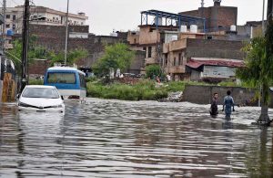 A view of vehicles moving through floodwater on the main Expressway following heavy monsoon rainfall in the Federal Capital.