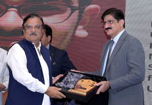 Sindh Chief Minister Syed Murad Ali Shah presents a shield to a successful scholar during the felicitation ceremony organised by the College Education Department at CM House, Karachi, Sindh.