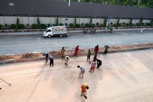 Heavy machinery work alongside labourers at the Park Road Underpass project site, as construction work on the much-anticipated infrastructure project nears completion in the Federal Capital