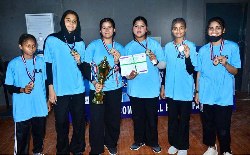 A group photo of Net ball team of Shah Latif Girls collage with wining trophy during closing ceremony of 5th PNF net ball cup 2026 at Hyderabad club