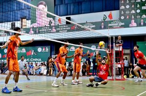 Players in action during volleyball match between Gujranwala and Lahore Volley ball teams during Pak-China Friendship Games to celebrate 75 years of diplomatic ties between Pakistan and China at multiple venues of the Nishtar Park Sports Complex