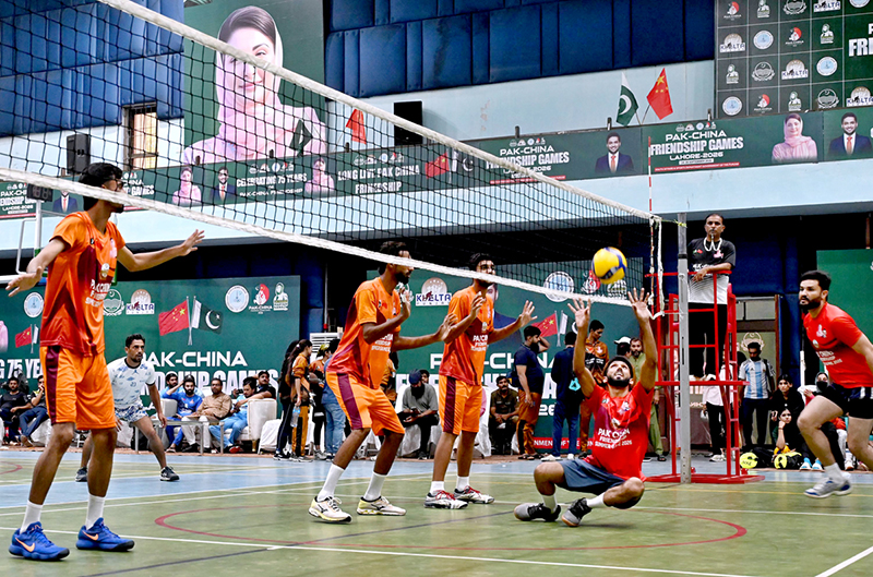 Players in action during volleyball match between Gujranwala and Lahore Volley ball teams during Pak-China Friendship Games to celebrate 75 years of diplomatic ties between Pakistan and China at multiple venues of the Nishtar Park Sports Complex