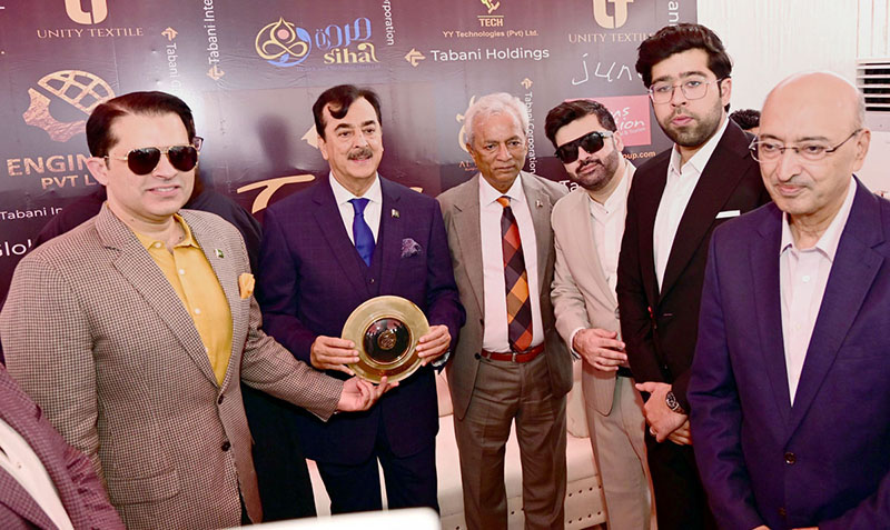 Renowned businessman Hamza Tabani presents a commemorative shield to Chairman Senate Syed Yousaf Raza Gilani during a luncheon hosted by Hamza Tabani in honour of Chairman Senate Syed Yousaf Raza Gilani and Sindh Governor Nehal Hashmi