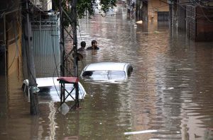 A view of vehicles moving through floodwater on the main Expressway following heavy monsoon rainfall in the Federal Capital.