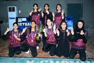 A group photo of Net ball team of Shah Latif Girls collage with wining trophy during closing ceremony of 5th PNF net ball cup 2026 at Hyderabad club