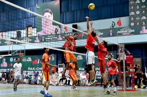 Players in action during volleyball match between Gujranwala and Lahore Volley ball teams during Pak-China Friendship Games to celebrate 75 years of diplomatic ties between Pakistan and China at multiple venues of the Nishtar Park Sports Complex
