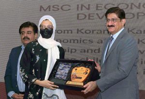 Sindh Chief Minister Syed Murad Ali Shah presents a shield to a successful scholar during the felicitation ceremony organised by the College Education Department at CM House, Karachi, Sindh.