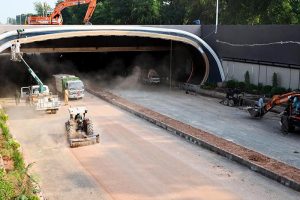 Heavy machinery work alongside labourers at the Park Road Underpass project site, as construction work on the much-anticipated infrastructure project nears completion in the Federal Capital
