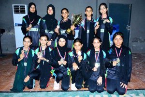 A group photo of Net ball team of Shah Latif Girls collage with wining trophy during closing ceremony of 5th PNF net ball cup 2026 at Hyderabad club