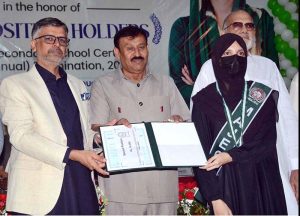 Chairman BISE Faisalabad Dr. Rana Binyamin presents certificates and medals to position-holder students at a ceremony announcing the Intermediate Examination 2026 results.