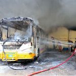 Firefighters struggles to extinguish fire that erupted in a bus after a blaze broke out in the parking area of Government College Women University Faisalabad (GCWUF), caused by the battery of an electric scooter exploding while charging