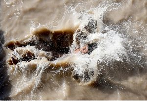 Youngsters diving in Rice Canal to get relief from scorching hot and humid weather.