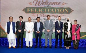 Sindh Chief Minister Syed Murad Ali Shah presents a shield to a successful scholar during the felicitation ceremony organised by the College Education Department at CM House, Karachi, Sindh.