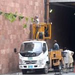 PHA workers place pots of plants on wall of Shadman Underpass as part of efforts to beautify the provincial capital