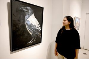 Visitors take keen interest in artworks by artists during the group exhibition titled “Figure, Form & Field” at Gallery 6.