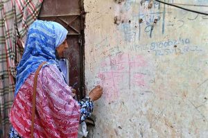 A lady health worker administers polio drops to a child during an anti-polio campaign aimed at a polio-free Pakistan.