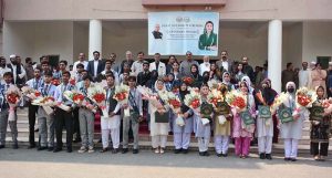 Chairman BISE Faisalabad Dr. Rana Binyamin presents certificates and medals to position-holder students at a ceremony announcing the Intermediate Examination 2026 results.