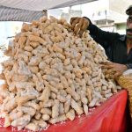A vendor selling traditional sweet items at Bandar Road