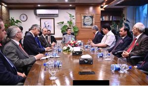 Acting President Syed Yousuf Raza Gilani attending a briefing at Islamabad Stock Exchange (ISE) Towers Limited.