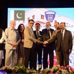 Federal Minister for Education and Professional Training Dr Khalid Maqbool Siddiqui being presented with a shield at a ceremony marking the departure of the first batch of IOD diploma students for China