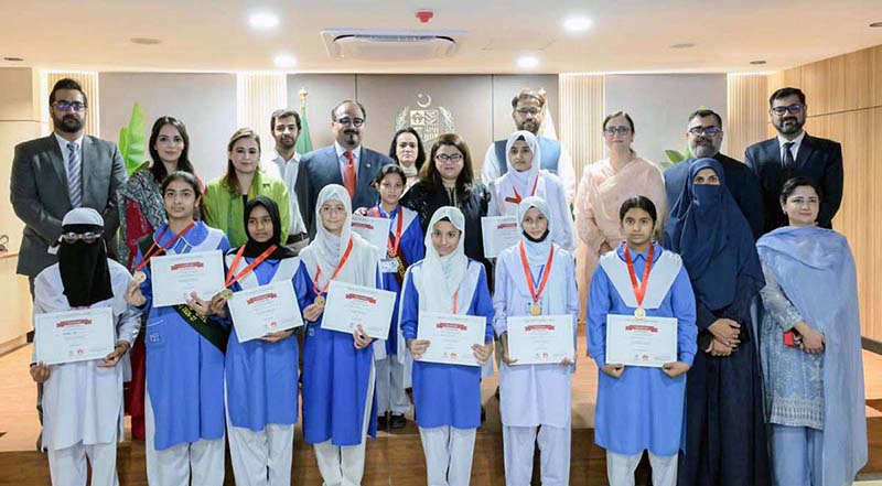 Federal Minister for Information Technology and Telecommunication, Ms. Shaza Fatima Khawaja, in a group photograph with students who successfully completed the Huawei Summer ICT Training Programme