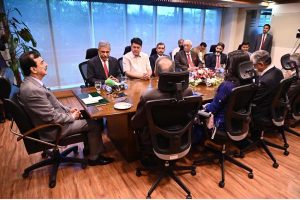 Acting President Syed Yousuf Raza Gilani attending a briefing at Islamabad Stock Exchange (ISE) Towers Limited.