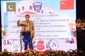 Federal Minister for Education and Professional Training Dr Khalid Maqbool Siddiqui being presented with a shield at a ceremony marking the departure of the first batch of IOD diploma students for China