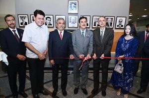 Acting President Syed Yousuf Raza Gilani in a group photograph with members of the Board of Directors of Islamabad Stock Exchange (ISE) Towers Limited.